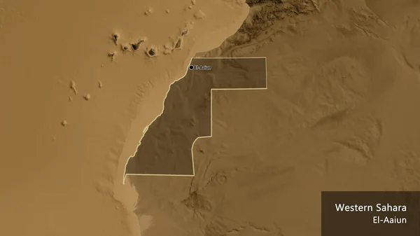 Close-up of the Western Sahara border area highlighting with a dark overlay on a sepia elevation map. Capital point. Outline around the country shape. English name of the country and its capital
