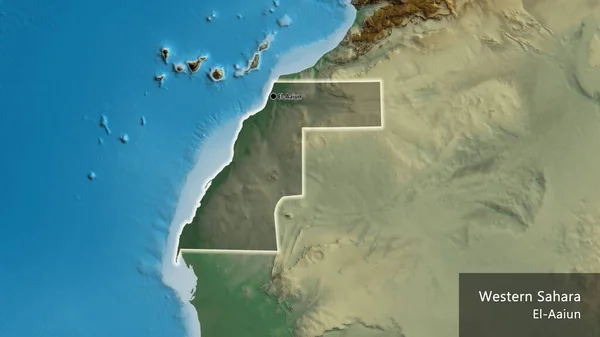 Close-up of the Western Sahara border area highlighting with a dark overlay on a relief map. Capital point. Glow around the country shape. English name of the country and its capital