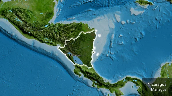 衛星地図上の暗いオーバーレイで強調しているニカラグア国境地域のクローズアップ 資本ポイント 国の形の周りに光る 英名国とその首都 — ストック写真