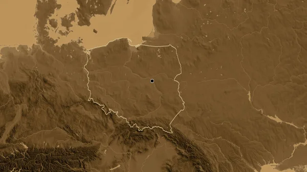 Close-up of the Poland border area on a sepia elevation map. Capital point. Outline around the country shape.