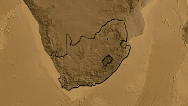 Close-up of the South Africa border area on a sepia elevation map. Capital point. Bevelled edges of the country shape.