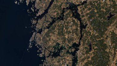 Orust Island in the Skagerrak on a satellite image taken in March 5, 2021 clipart