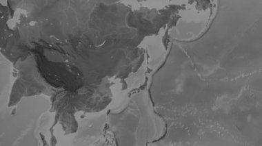 Patterson silindirik projeksiyonunda Dünya 'nın gri ölçekli yükseliş haritasının arka planında Japon Denizi bölgesi