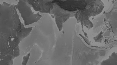 Patterson silindirik projeksiyonunda dünyanın gri ölçekli yükseklik haritasının arka planında Lackadiv Denizi bölgesi