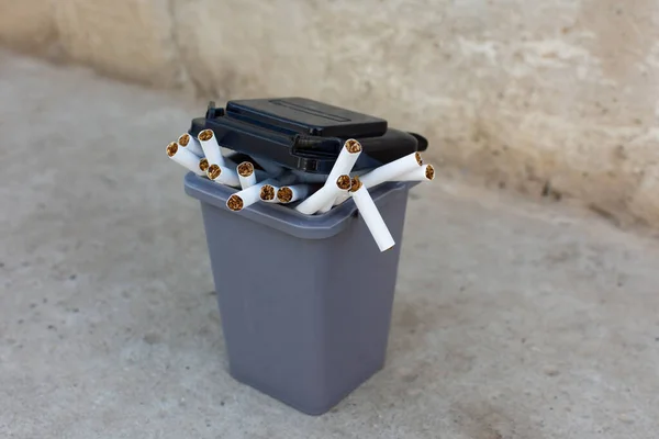 cigarettes in the trash can. to give up smoking. High quality photo