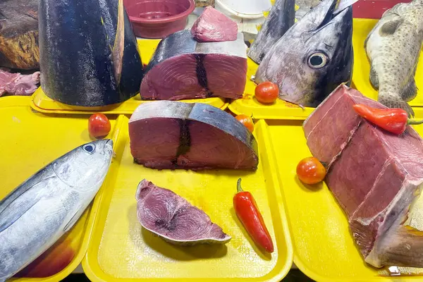Fresh tuna fish at a fish market in Asia. Cut fish.