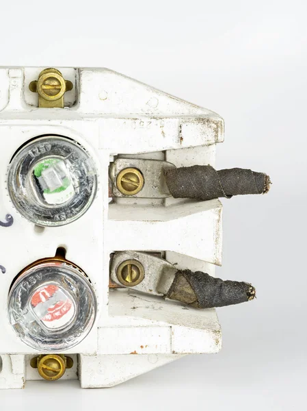 Antique fuse box closeup with glass fuses