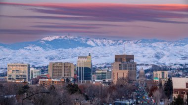 Snow covered foothills over Boise at sunset