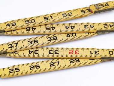 Antique wood ruler that colds on hinges