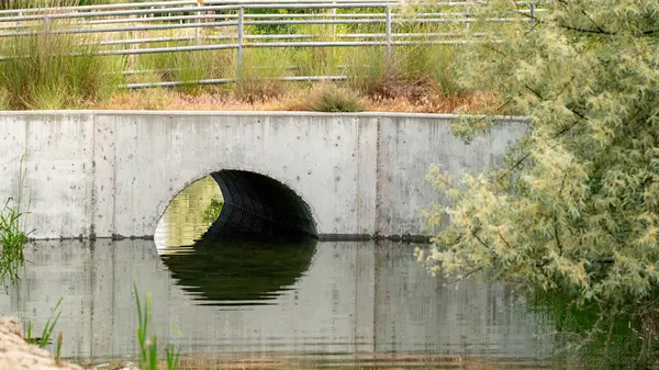 stock image Single culvert allowing a creek to flow