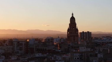 Sunset in Murcia with the cathedral tower in the background