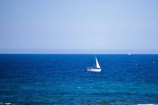 stock image Nice seascape with boats going through the surf in vacation time