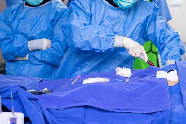 stock image surgeon team working in operating room, Stem cells operation, Plasma in syringe, Health care concept