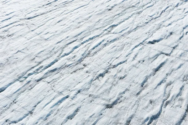 日光の下でのスヴァールバルの白北極氷河のテクスチャに関する航空写真 — ストック写真