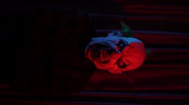 scary clown in front of a mirror horror effect lightening concept . High quality 4k footage