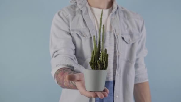 Vertical Video White Man Holding Cactus Pot Mens Problems High — Stockvideo