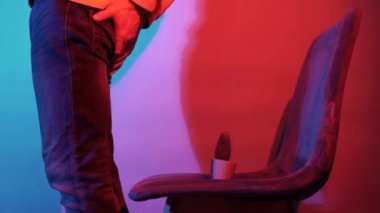 Men Suffering from Hemorrhoid Pain sitting on cactus chair in studio lights. High quality 4k footage