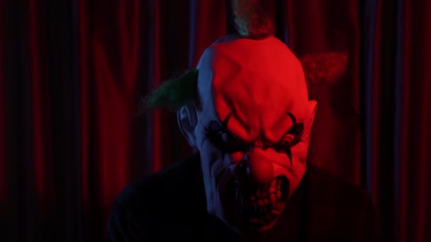 Dangerous Clown Horror Mask Font Curtain Red Light High Quality — Stockvideo