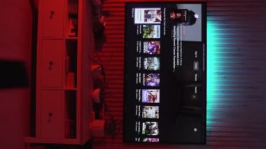 Sofia, Bulgaria-12 01 2023:twitch app browsing and scrolling on a big TV at home vertical video. High quality 4k footage