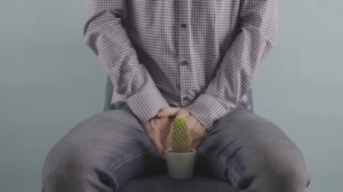 man sitting on chair Prostate problems conception studio shot mens health . High quality 4k footage