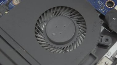 macro shot cleaning laptop cooling system during maintenance. Repair laptop device concept. High quality 4k footage