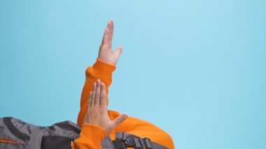 vertical video of presentation gestures on blue studio backround . High quality FullHD footage