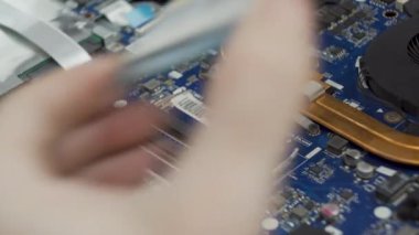 Macro shot taken while performing maintenance on the laptop cooling system. Concept for computer device repair. High quality 4k footage