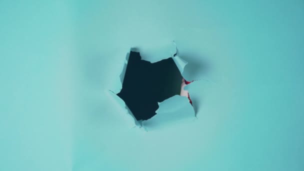 Clown Peeking Paper Hole Set Chilling Blue Background Shot Ideal — Wideo stockowe