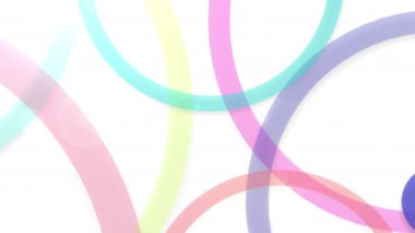 Mor, mor, mor, morumsu ve elektrik mavisi gibi çeşitli renkli daireler beyaz bir zeminde havada süzülerek canlı ve sanatsal daireler oluşturur.