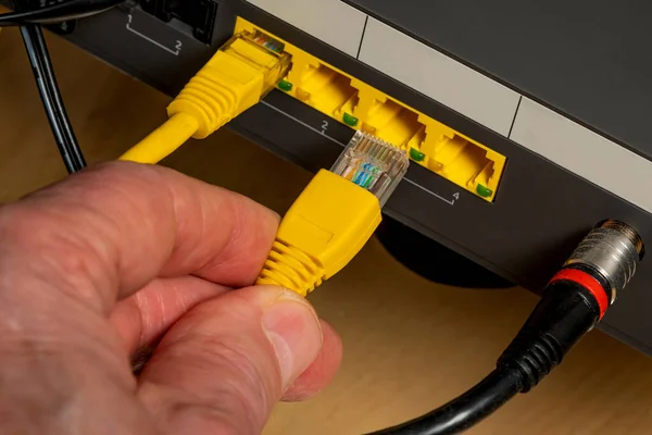 Connecting the device to the Internet using a cable. Close up.