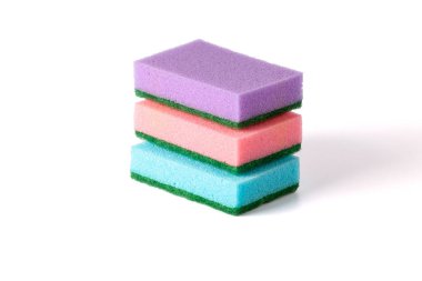 A stack of colored kitchen sponges isolated against white background. Multi-colored Dish washing sponges.