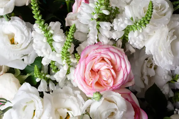 Rose flower bouquet close up. Background of white and pink roses