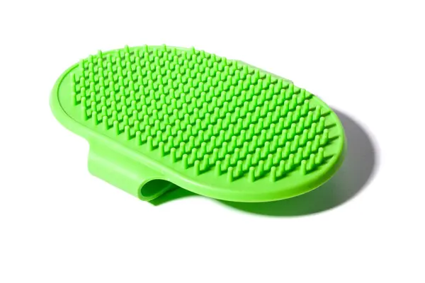 stock image Green silicone brush for grooming pets, featuring soft bristles, isolated on a white background