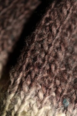 Colorful handmade winter traditional scarf with alpacas wool close up background modern high quality prints