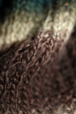 Colorful handmade winter traditional scarf with alpacas wool close up background modern high quality prints