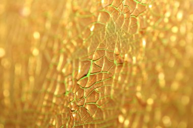 Makro tuvale altın boya dökülmüş. Modern arka plan. Yüksek kaliteli. Büyük boy hazır baskılar.