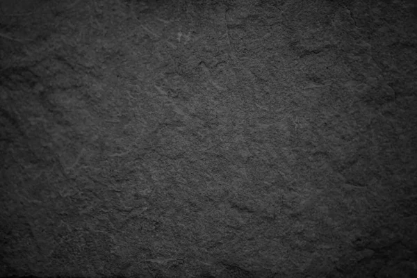 暗い灰色の黒いスレートの石の背景か質および勾配の影 設計のためのスペースが付いている水平な形 ストック写真