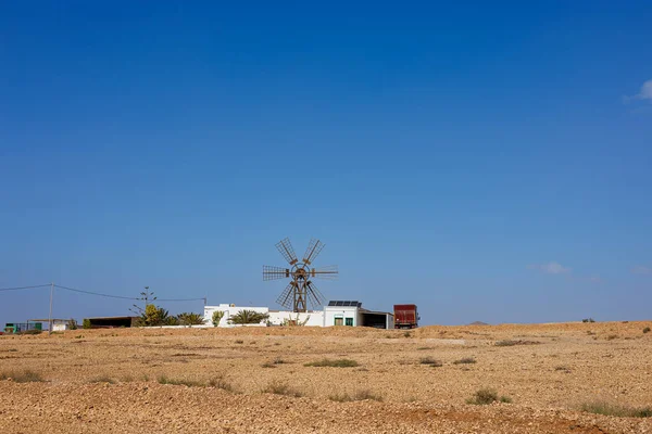 stock image Farming with windmill on the island of Fuerteventura in the Canary Islands