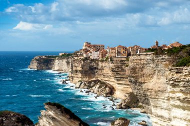 The city of Bonifacio at the edge of the cliff, Corsica France. clipart