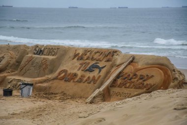 Durban tourism sand art at golden mile beach promenade KZN