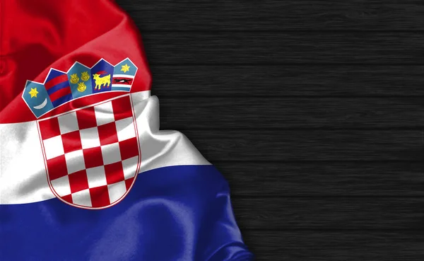 黒い木製の背景の上にクロアチアの旗の閉鎖 — ストック写真