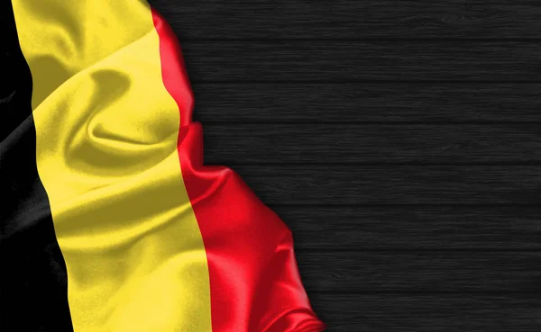 Zbliżenie Flagi Belgii Szczycie Czarnego Drewnianego Tła — Zdjęcie stockowe