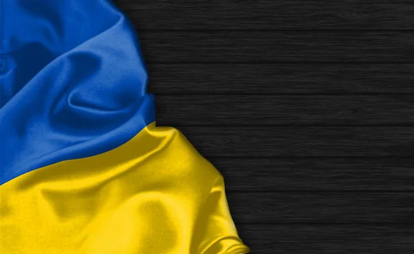 Zbliżenie Flagi Ukrainy Szczycie Czarnego Drewnianego Tła — Zdjęcie stockowe