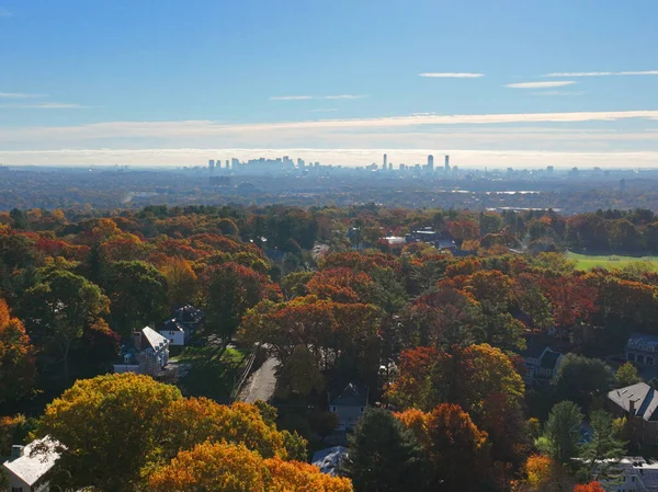 Stock image Belmont suburban landscape aerial view in fall with Boston modern city skyline in town of Belmont, Massachusetts MA, USA. 