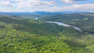 Pemigewasset River and New Hampton historic center aerial view from Hersey Mountain in summer, with White Mountain at the background, New Hampton, New Hampshire NH, USA. 
