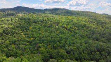 Flying up to Hersey Mountain in summer from town center of New Hampton, New Hampshire NH, USA. Hersey Mountain is between town of New Hampton and Sanbornton. 