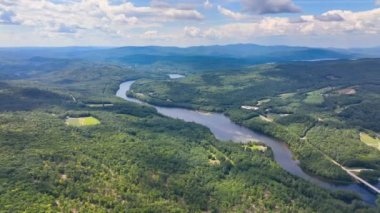 Pemigewasset River and New Hampton historic center aerial view from Hersey Mountain in summer, with White Mountain at the background, New Hampton, New Hampshire NH, USA. 