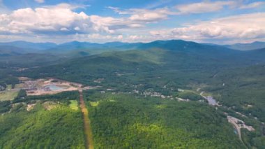 Aerial view of Campton Mountain, Pemigewasset River and Interstate Highway I-93 in summer with White Mountain National Forest at the background in town of Campton, New Hampshire NH, USA. 