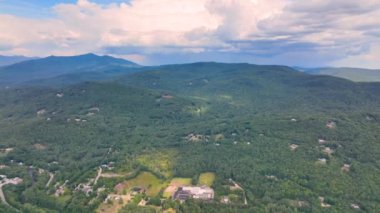 Aerial view of Campton Mountain, Pemigewasset River and Interstate Highway I-93 in summer with White Mountain National Forest at the background in town of Campton, New Hampshire NH, USA. 