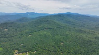 Flying over the Campton Mountain in summer with White Mountain National Forest at the background in town of Campton, New Hampshire NH, USA. 